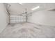 An empty two car garage with an automatic garage door at 450 Windmill Palm Cir, Altamonte Springs, FL 32701