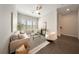 Bright living room featuring a neutral color palette, stylish furnishings, and lots of natural light at 450 Windmill Palm Cir, Altamonte Springs, FL 32701