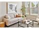 Bright living room featuring a comfortable sofa, modern decor, and plenty of natural light at 450 Windmill Palm Cir, Altamonte Springs, FL 32701