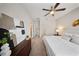 Spacious main bedroom with a ceiling fan, a large window, and tasteful decor at 450 Windmill Palm Cir, Altamonte Springs, FL 32701