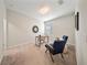 Bright home office featuring neutral carpeting, a desk, and comfortable seating at 450 Windmill Palm Cir, Altamonte Springs, FL 32701