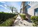 Charming townhomes with landscaped walkway and street view showcasing curb appeal and neighborhood charm at 450 Windmill Palm Cir, Altamonte Springs, FL 32701