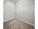 Spacious walk-in closet with carpet flooring, providing ample storage with installed shelving at 450 Windmill Palm Cir, Altamonte Springs, FL 32701