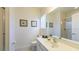 Neat bathroom featuring sink, toilet, and shower with glass door at 4507 Monado Dr, Kissimmee, FL 34746