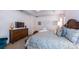 Relaxing bedroom features a dresser with TV and king sized bed at 4507 Monado Dr, Kissimmee, FL 34746