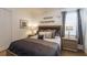 Cozy bedroom features a soft bed, nightstands, and decorative wall art at 4507 Monado Dr, Kissimmee, FL 34746