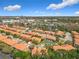 Panoramic aerial view of a community featuring lush landscaping and scenic lakes at 4952 Matteo Trl, Orlando, FL 32839