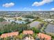 Community aerial view showcasing lush surroundings, serene ponds, and convenient parking at 4952 Matteo Trl, Orlando, FL 32839