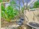 Cozy backyard with a swinging chair, lush palms, and a welcoming atmosphere for relaxation and outdoor enjoyment at 4952 Matteo Trl, Orlando, FL 32839