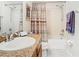 Bathroom featuring a single sink vanity and a shower-tub with a curtain at 4952 Matteo Trl, Orlando, FL 32839