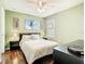Bedroom featuring a queen size bed with nightstands, and a dresser with a mirror at 4952 Matteo Trl, Orlando, FL 32839