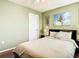 Bedroom featuring a queen size bed with nightstands, and a ceiling fan at 4952 Matteo Trl, Orlando, FL 32839