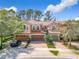 Charming townhome with a three-car garage, well-maintained landscaping, and a lovely brick driveway at 4952 Matteo Trl, Orlando, FL 32839