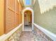 Inviting front entrance with stone accents and arched doorway, creating a warm and welcoming first impression at 4952 Matteo Trl, Orlando, FL 32839