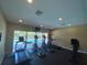 Gym featuring various exercise machines and overlooking an adjacent pool at 4952 Matteo Trl, Orlando, FL 32839