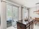 Kitchen island features a granite countertop with adjacent dining area and lanai access at 4952 Matteo Trl, Orlando, FL 32839