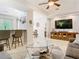 Spacious living room flows into the kitchen and dining areas at 4952 Matteo Trl, Orlando, FL 32839