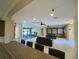 Open concept lounge area with tile floors offering a view of the community gym at 4952 Matteo Trl, Orlando, FL 32839