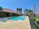 Community pool with a clubhouse and lakeside view, ideal for outdoor relaxation and enjoying the scenery at 4952 Matteo Trl, Orlando, FL 32839