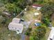 Expansive property featuring a two-story home, detached garage, outdoor fire pit, and additional structures at 500 Forest Lake Dr, Altamonte Springs, FL 32714