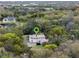 Aerial view of property with surrounding trees and lake, with a green marker indicating the property's location at 500 Forest Lake Dr, Altamonte Springs, FL 32714