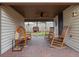 Charming outdoor seating area with a brick floor, featuring comfortable chairs and a ceiling fan at 500 Forest Lake Dr, Altamonte Springs, FL 32714