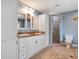 Stylish bathroom featuring a dual sink vanity with granite counters and a tiled walk-in shower at 500 Forest Lake Dr, Altamonte Springs, FL 32714