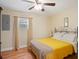 Bright bedroom with hardwood floors, large window, and ceiling fan at 500 Forest Lake Dr, Altamonte Springs, FL 32714