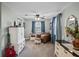 Cozy bedroom with plenty of natural light, a ceiling fan, and comfortable seating area at 500 Forest Lake Dr, Altamonte Springs, FL 32714