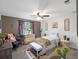 Cozy bedroom showcasing a full size bed, sunflower accents, and neutral colors at 500 Forest Lake Dr, Altamonte Springs, FL 32714