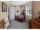 Cozy bedroom with comfortable chair, natural light, and neutral colors at 500 Forest Lake Dr, Altamonte Springs, FL 32714