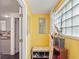 Bright entryway featuring a window, a storage bench, a mirror and access to other rooms at 500 Forest Lake Dr, Altamonte Springs, FL 32714