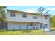 Charming two-story home with neutral siding, a covered porch, and a well-manicured lawn at 500 Forest Lake Dr, Altamonte Springs, FL 32714