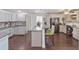 Bright kitchen with gray cabinets, stainless steel appliances, granite countertops and bar seating at 500 Forest Lake Dr, Altamonte Springs, FL 32714
