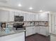 A modern kitchen featuring stainless steel appliances, granite counters, and tile backsplash at 500 Forest Lake Dr, Altamonte Springs, FL 32714