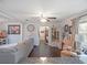 Cozy living room featuring hardwood floors, neutral decor, and a partial view of the dining area at 500 Forest Lake Dr, Altamonte Springs, FL 32714