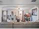 Cozy living room featuring plush gray sofa, decorative fireplace, and stylish furnishings for a relaxing ambiance at 500 Forest Lake Dr, Altamonte Springs, FL 32714