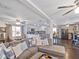 Inviting living room with plush seating, hardwood floors, and an open layout leading into the kitchen at 500 Forest Lake Dr, Altamonte Springs, FL 32714