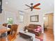 Living room featuring wood floors, ceiling fan, a sofa and a sitting area at 500 Forest Lake Dr, Altamonte Springs, FL 32714