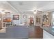 Spacious living room with hardwood floors, ceiling fans, and a view into the dining area at 500 Forest Lake Dr, Altamonte Springs, FL 32714