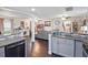 Open concept kitchen overlooking living room with hardwood floors and modern decor creating a bright and airy space at 500 Forest Lake Dr, Altamonte Springs, FL 32714