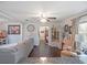Bright living room with wood floors, large sofa and view into dining area; perfect for Gathering gatherings at 500 Forest Lake Dr, Altamonte Springs, FL 32714
