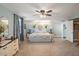 Spacious main bedroom with a ceiling fan and lots of decorative furniture at 500 Forest Lake Dr, Altamonte Springs, FL 32714