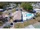 This aerial view showcases the clubhouse and a sparkling pool providing relaxation and recreation for the community at 519 Tivoli Park Dr, Davenport, FL 33897