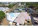 An aerial view of the community pool, tennis courts, clubhouse, and recreational facilities at 519 Tivoli Park Dr, Davenport, FL 33897