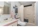 Small bathroom with wallpaper, a toilet, shower, and vanity with storage space at 519 Tivoli Park Dr, Davenport, FL 33897