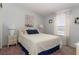 Comfortable bedroom with a bed, a nightstand, and a window with ample natural light at 519 Tivoli Park Dr, Davenport, FL 33897
