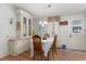 Dining area with wooden table and chairs, hutch, and natural lighting at 519 Tivoli Park Dr, Davenport, FL 33897