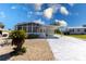 Charming single-story home featuring a screened-in porch and covered parking at 519 Tivoli Park Dr, Davenport, FL 33897