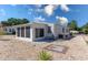 Exterior elevation of a charming single-story home with gravel landscaping and an enclosed lanai at 519 Tivoli Park Dr, Davenport, FL 33897